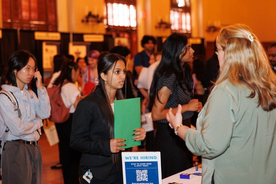 Students and employers connecting at an iSchool career event.