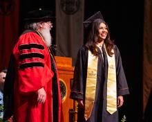 Interim Dean Fleischmann with graduate