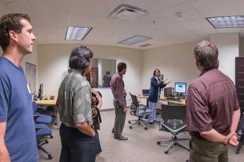 Faculty members offer visitors a tour of the Information eXperience lab