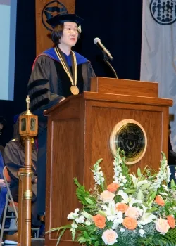 iSchool Interim Dean Soo Young Rieh speaking at graduation
