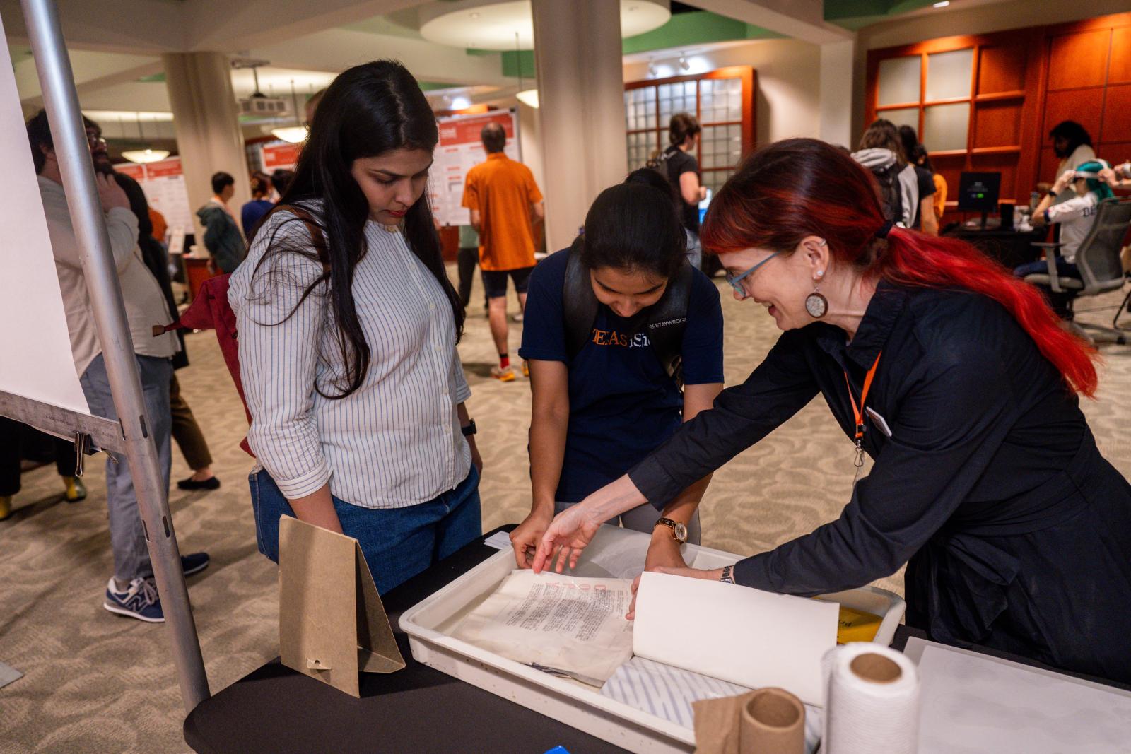 Researcher demoing a paper preservation technique