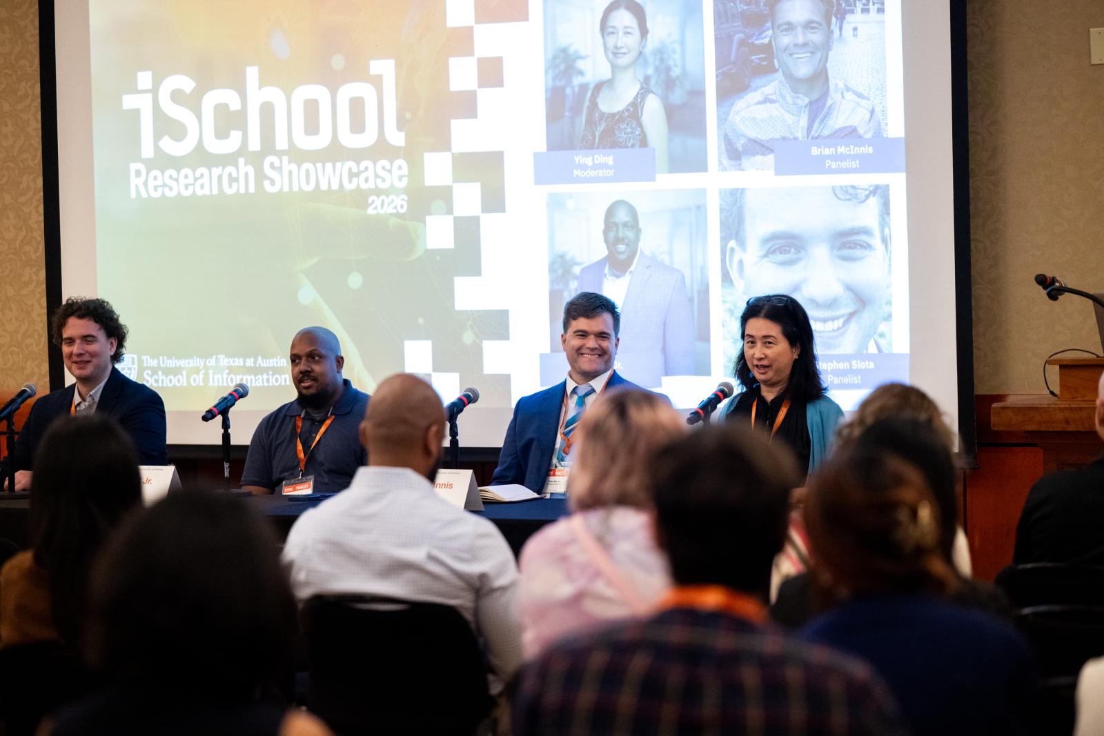 Research showcase panelists speaking to crowd