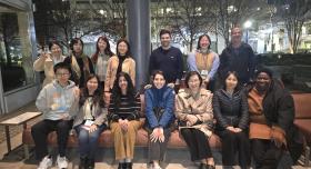 iSchool students and faculty smiling for a group photo