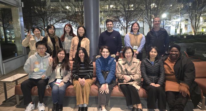 iSchool students and faculty smiling for a group photo