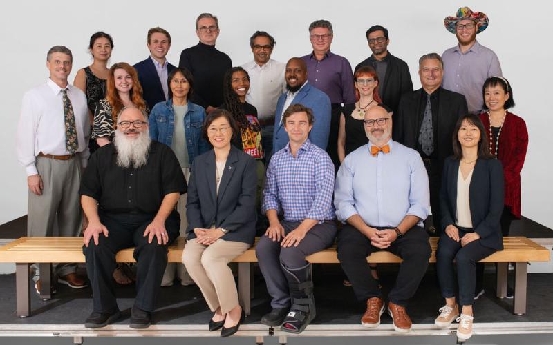 iSchool faculty sitting together and smiling 