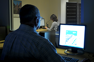 A researcher observing a research subject in the iSchool&#039;s Information eXperience Lab
